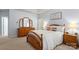 Comfortable main bedroom featuring a tray ceiling, dresser with mirror and neutral wall color at 4389 Enchantment Cove Ln, Charlotte, NC 28216