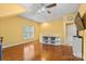 Bright bonus room featuring a ceiling fan, hardwood floors, a storage shelf, and plenty of natural light at 4389 Enchantment Cove Ln, Charlotte, NC 28216