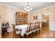 Charming formal dining room with a large table for eight and china cabinet at 4389 Enchantment Cove Ln, Charlotte, NC 28216