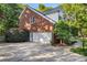 Spacious two-car garage with an extended driveway and well-maintained landscaping at 4389 Enchantment Cove Ln, Charlotte, NC 28216
