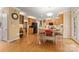 Spacious eat-in kitchen with wood floors, wood cabinetry, stainless appliances, and a center island at 4389 Enchantment Cove Ln, Charlotte, NC 28216