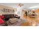 Open-concept living room with hardwood floors that flows into the kitchen and dining area at 4389 Enchantment Cove Ln, Charlotte, NC 28216