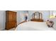 Bright and comfortable main bedroom with a wardrobe and closet, featuring neutral decor at 4389 Enchantment Cove Ln, Charlotte, NC 28216