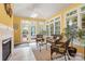 Bright sunroom with tile floors, ample windows, and comfortable seating at 4389 Enchantment Cove Ln, Charlotte, NC 28216
