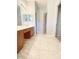 Bathroom featuring tiled floors, a spacious vanity with double sinks, and modern fixtures, offers comfort at 4467 Antelope Ln, Charlotte, NC 28269
