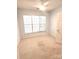 Bedroom with neutral carpet, ceiling fan and a large window allowing natural light at 4467 Antelope Ln, Charlotte, NC 28269