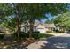 Landscaped front of a well-maintained home with trees, shrubs, a two-car garage, and inviting curb appeal at 4467 Antelope Ln, Charlotte, NC 28269