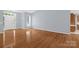 Bright living room featuring hardwood floors, neutral walls, and a large window for lots of natural light at 4467 Antelope Ln, Charlotte, NC 28269