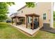Expansive backyard featuring a double covered patio with a grill and ample space for outdoor enjoyment at 4935 Norman Park Pl, Clover, SC 29710