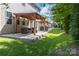 Inviting backyard with covered patio and lush green lawn, perfect for outdoor entertaining at 4935 Norman Park Pl, Clover, SC 29710