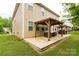 Large backyard featuring a double covered patio, perfect for entertaining and enjoying outdoor living at 4935 Norman Park Pl, Clover, SC 29710