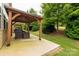 Covered patio featuring a seating area and backyard views, ideal for relaxation and entertaining guests at 4935 Norman Park Pl, Clover, SC 29710