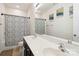 Bathroom featuring a double sink vanity, decorative shower curtain, and modern fixtures at 4935 Norman Park Pl, Clover, SC 29710