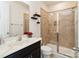 Stylish bathroom featuring tiled shower with glass door and a marble countertop vanity sink at 4935 Norman Park Pl, Clover, SC 29710