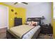Comfortable bedroom with bright yellow walls, plush carpet, and a large bed, perfect for relaxing at 4935 Norman Park Pl, Clover, SC 29710