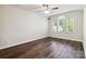 Spacious bedroom featuring wood flooring, vaulted ceiling, and a large window that fills the room with natural light at 4935 Norman Park Pl, Clover, SC 29710