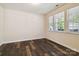 Empty bedroom featuring wood flooring, and natural light from the large window at 4935 Norman Park Pl, Clover, SC 29710