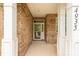 Covered front porch with brick columns and brick facade providing a welcoming entrance to the home at 4935 Norman Park Pl, Clover, SC 29710