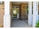 Welcoming front porch with brick columns and a glass-paneled front door at 4935 Norman Park Pl, Clover, SC 29710