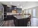 Well-equipped kitchen boasts granite countertops, dark cabinets, and stainless-steel appliances at 4935 Norman Park Pl, Clover, SC 29710