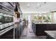 Open kitchen featuring granite countertops, stainless-steel appliances, and dark cabinets at 4935 Norman Park Pl, Clover, SC 29710