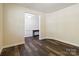 Spacious living room featuring hardwood floors and neutral walls creating a warm and inviting atmosphere at 4935 Norman Park Pl, Clover, SC 29710