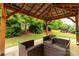Outdoor seating area features a covered gazebo with comfortable seating and a view of the backyard at 4935 Norman Park Pl, Clover, SC 29710