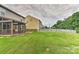 Large back yard with both a screened in patio and a white picket fence at 5011 Blue Stream Ln, Indian Trail, NC 28079