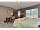 Bedroom with windows, desk, TV and a comfortable feel at 5011 Blue Stream Ln, Indian Trail, NC 28079