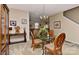 Dining area with a glass table, upholstered chairs, and a staircase in the background at 5011 Blue Stream Ln, Indian Trail, NC 28079