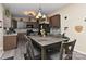 Inviting kitchen featuring stainless steel appliances, wooden cabinetry and a dining table at 5011 Blue Stream Ln, Indian Trail, NC 28079