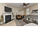 Well-appointed living room featuring a fireplace, large TV, and comfortable seating arrangements at 5011 Blue Stream Ln, Indian Trail, NC 28079