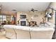 Open-concept living room with view to dining area, a fireplace, and comfortable seating at 5011 Blue Stream Ln, Indian Trail, NC 28079