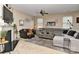 Spacious living room showcasing a fireplace, television, and plush furniture at 5011 Blue Stream Ln, Indian Trail, NC 28079