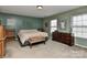 Main bedroom features light-colored carpet, window views, and plenty of space at 5011 Blue Stream Ln, Indian Trail, NC 28079