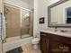 Traditional bathroom featuring a tiled shower-tub combination and marble countertops at 5425 Closeburn Rd, Charlotte, NC 28210