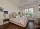 Comfortable bedroom featuring hardwood floors, natural lighting, and stylish decor at 5425 Closeburn Rd, Charlotte, NC 28210