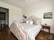 Comfortable bedroom featuring hardwood floors, natural lighting, and stylish decor at 5425 Closeburn Rd, Charlotte, NC 28210