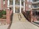 Elegant building entrance with brick accents and grand staircase at 5425 Closeburn Rd, Charlotte, NC 28210