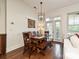 Dining room with hardwood floors, dining table and chairs and access to balcony at 5425 Closeburn Rd, Charlotte, NC 28210