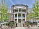 A stately brick building with white columns and manicured landscaping provides an attractive facade at 5425 Closeburn Rd, Charlotte, NC 28210