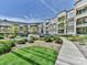Beautiful condo building with manicured landscaping and ample parking at 5425 Closeburn Rd, Charlotte, NC 28210
