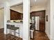 Gourmet kitchen featuring stainless steel appliances, granite countertops, and a breakfast bar at 5425 Closeburn Rd, Charlotte, NC 28210