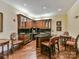 Charming kitchenette with hardwood floors, custom cabinetry, granite countertops, and seating area at 5425 Closeburn Rd, Charlotte, NC 28210