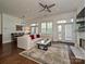 Inviting living room with hardwood floors, fireplace, natural light, and comfortable seating area at 5425 Closeburn Rd, Charlotte, NC 28210