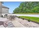 Beautiful backyard with a patio, an outdoor dining set, and landscaping at 5957 Redwood Pine Rd, Concord, NC 28027