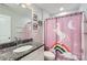 Bathroom with granite vanity and unicorn shower curtain at 5957 Redwood Pine Rd, Concord, NC 28027