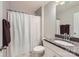 Well-lit bathroom featuring a shower with curtain, granite countertop, and sleek fixtures at 5957 Redwood Pine Rd, Concord, NC 28027