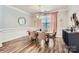 Elegant dining room with wainscoting, modern lighting, and tasteful decor at 5957 Redwood Pine Rd, Concord, NC 28027