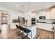 Bright, contemporary kitchen featuring a center island, white cabinetry, and stainless steel appliances at 5957 Redwood Pine Rd, Concord, NC 28027